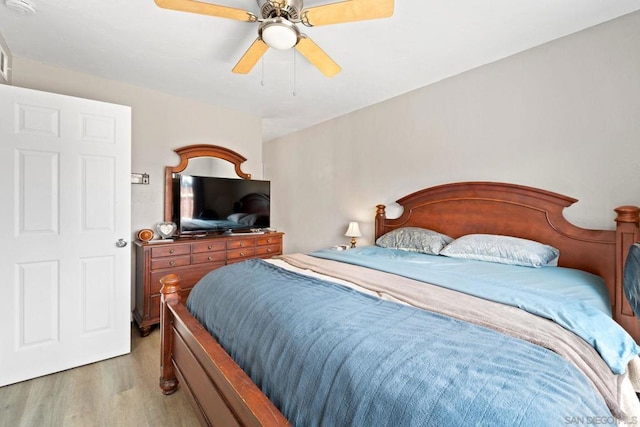 bedroom featuring ceiling fan and light hardwood / wood-style flooring