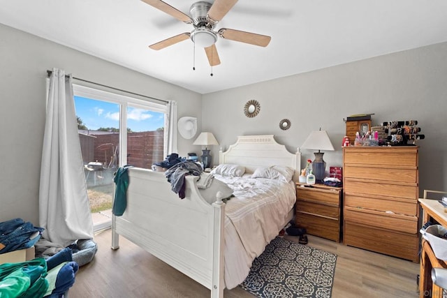 bedroom featuring access to outside, ceiling fan, and hardwood / wood-style floors