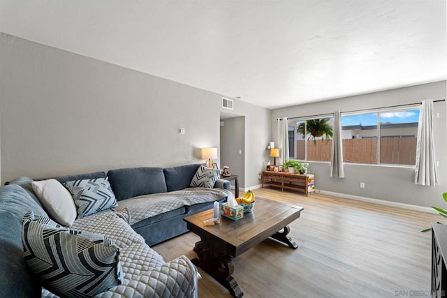 living room with light hardwood / wood-style floors