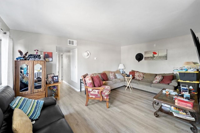 living room with light hardwood / wood-style floors