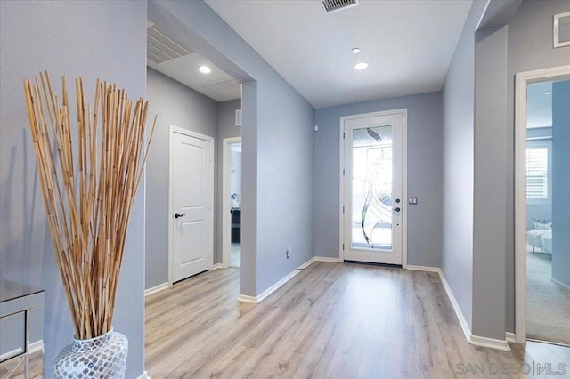 entryway with light hardwood / wood-style floors