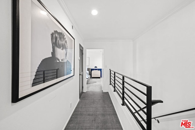 corridor featuring dark carpet and crown molding