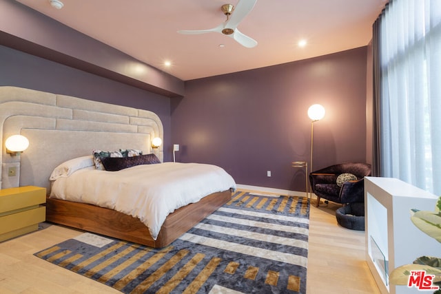 bedroom featuring ceiling fan and light hardwood / wood-style floors