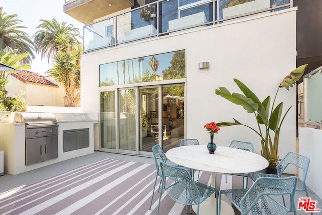 view of patio featuring exterior kitchen