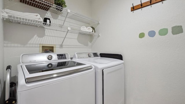 washroom featuring washing machine and dryer