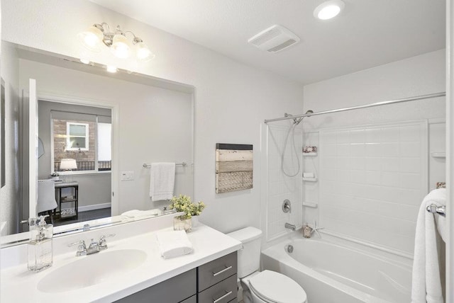 full bathroom featuring shower / tub combination, vanity, and toilet