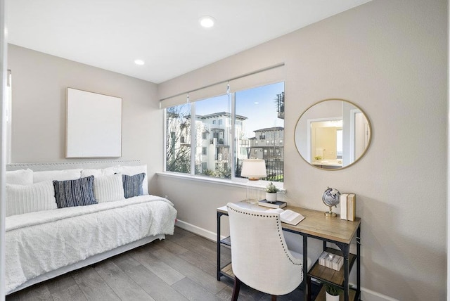 bedroom with hardwood / wood-style floors