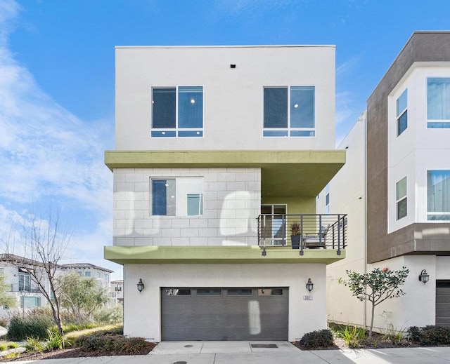 contemporary house with a balcony and a garage