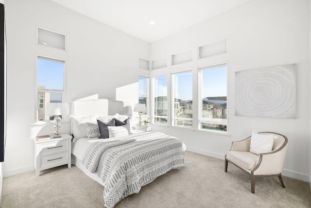 bedroom featuring light carpet