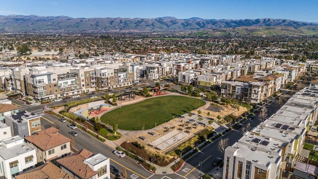 birds eye view of property featuring a mountain view