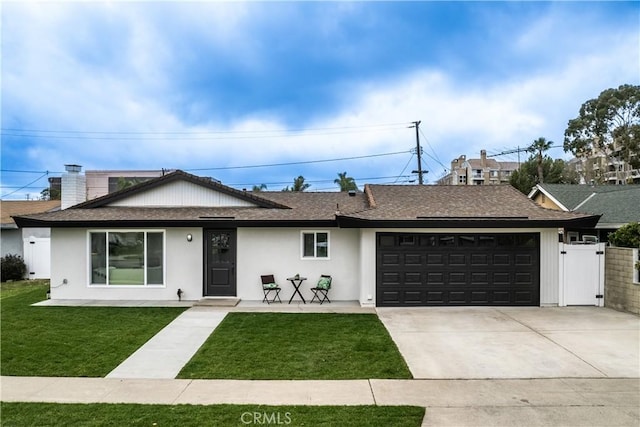 single story home with a garage and a front yard