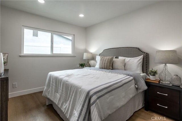 bedroom featuring dark hardwood / wood-style flooring