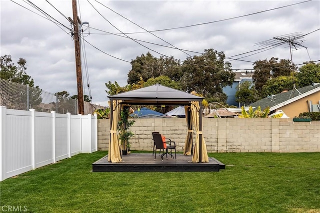 view of yard with a gazebo and a wooden deck