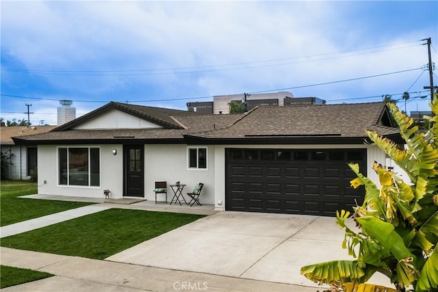 single story home featuring a garage and a front yard