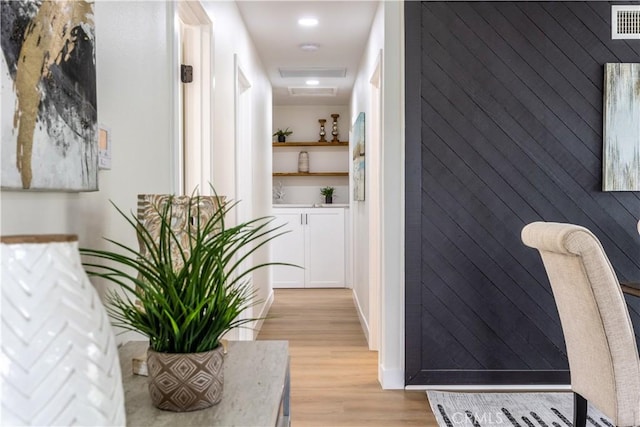 hall with light hardwood / wood-style flooring