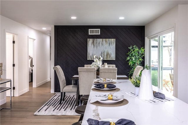 dining space featuring hardwood / wood-style flooring