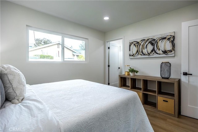 bedroom with hardwood / wood-style flooring