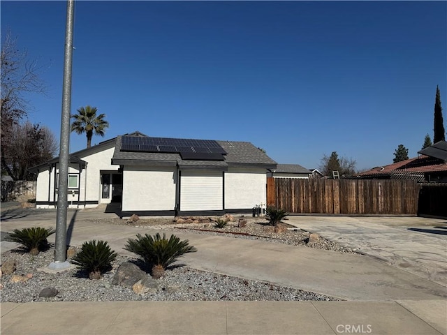 view of front of home with solar panels