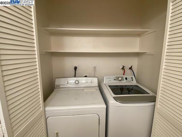 laundry room with separate washer and dryer