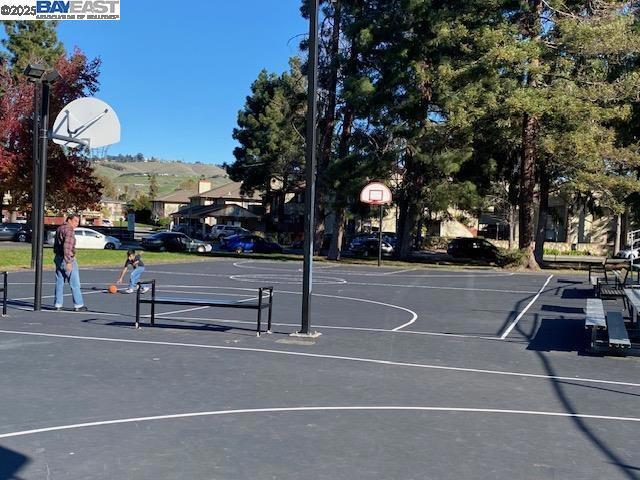 view of basketball court featuring a mountain view