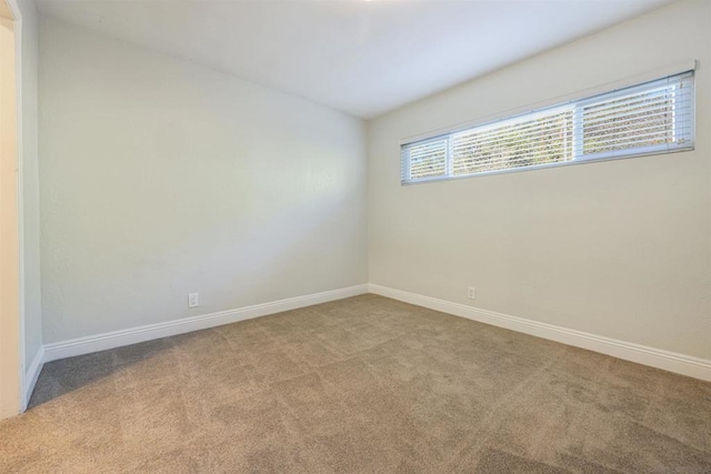 empty room featuring light colored carpet