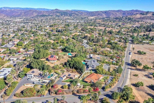 birds eye view of property featuring a mountain view