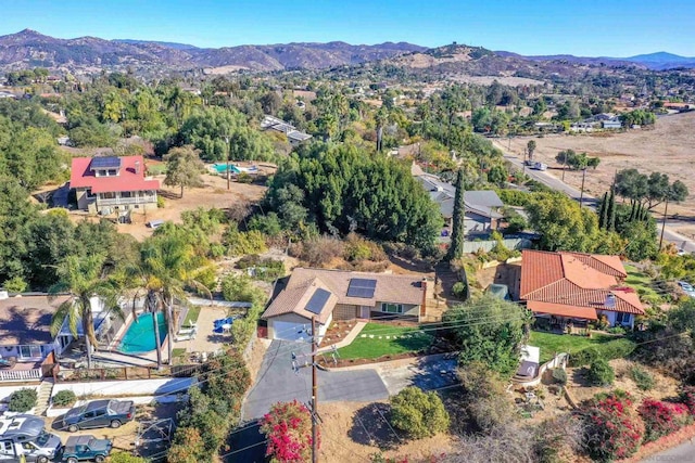 birds eye view of property with a mountain view