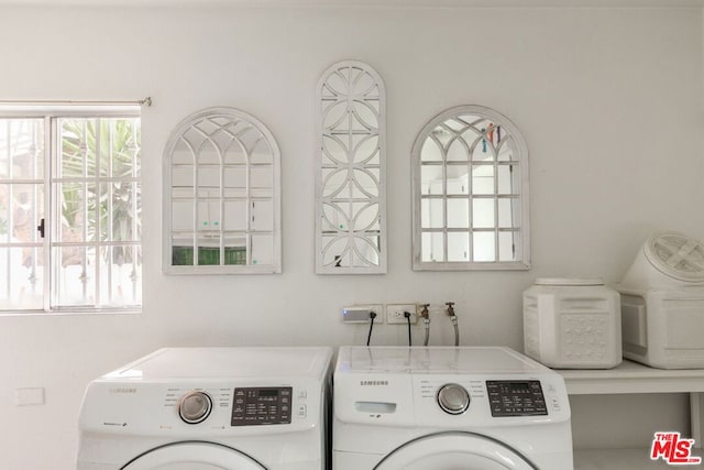 clothes washing area featuring washing machine and dryer