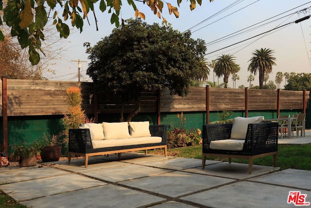 patio terrace at dusk with an outdoor hangout area