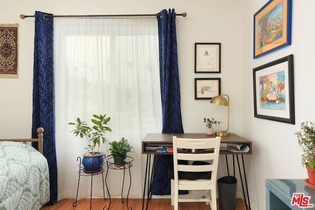 bedroom featuring hardwood / wood-style floors