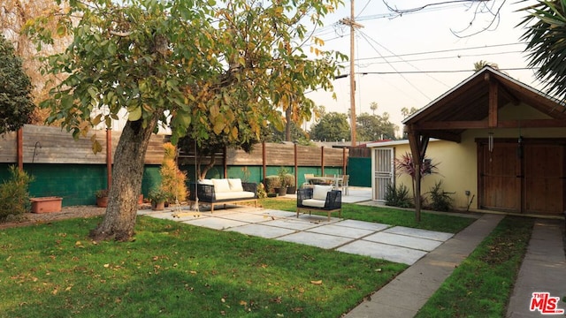 view of yard with an outdoor hangout area and a patio