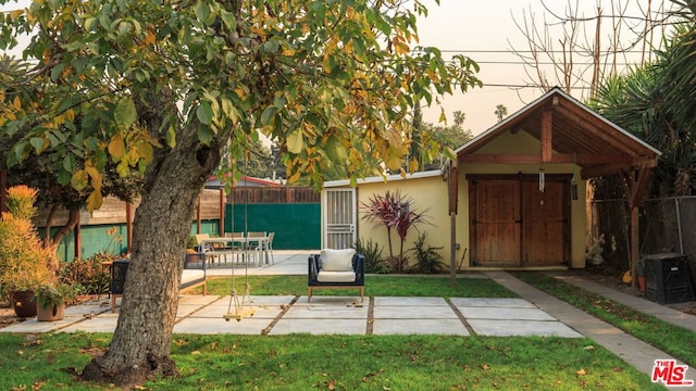 view of outbuilding with a yard