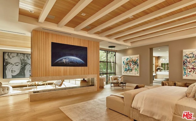 bedroom with hardwood / wood-style flooring, ensuite bathroom, beamed ceiling, and wood ceiling