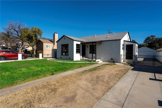 ranch-style home with a garage and a front yard