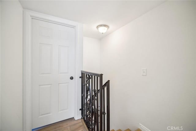 stairway featuring hardwood / wood-style flooring