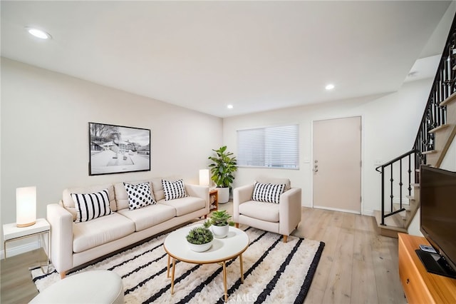 living room with light hardwood / wood-style flooring