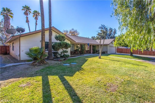 ranch-style home featuring a garage and a front yard