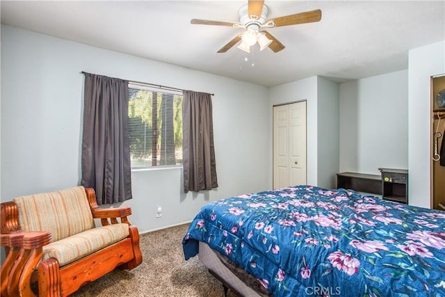 bedroom with carpet, ceiling fan, and a closet