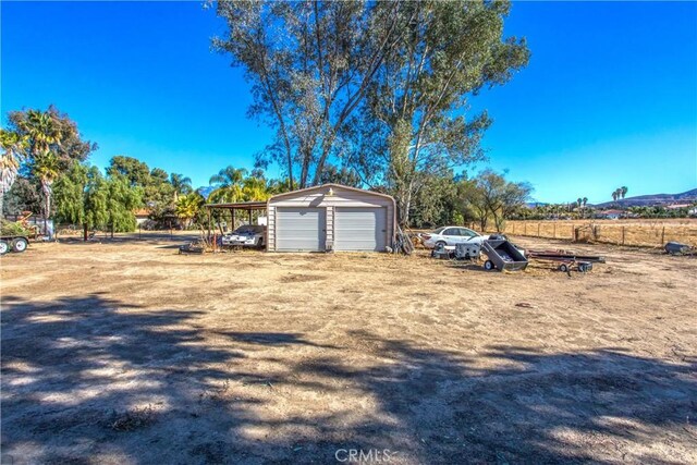 view of yard with an outbuilding and a garage