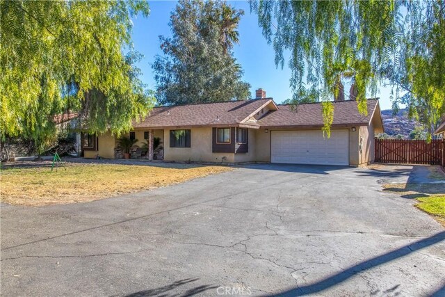 ranch-style house featuring a garage