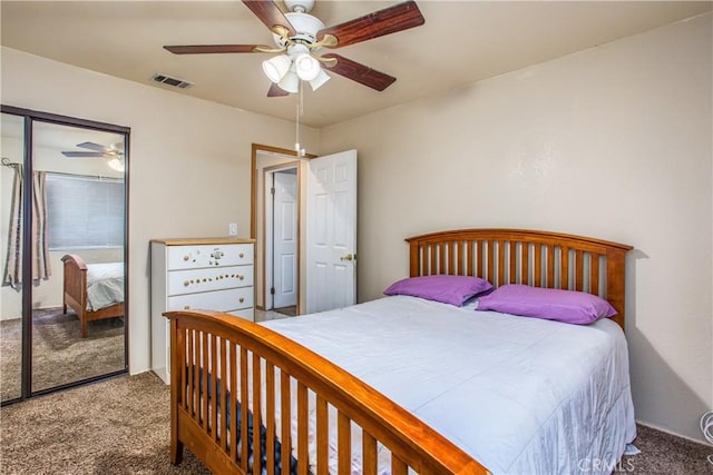 carpeted bedroom with ceiling fan and a closet