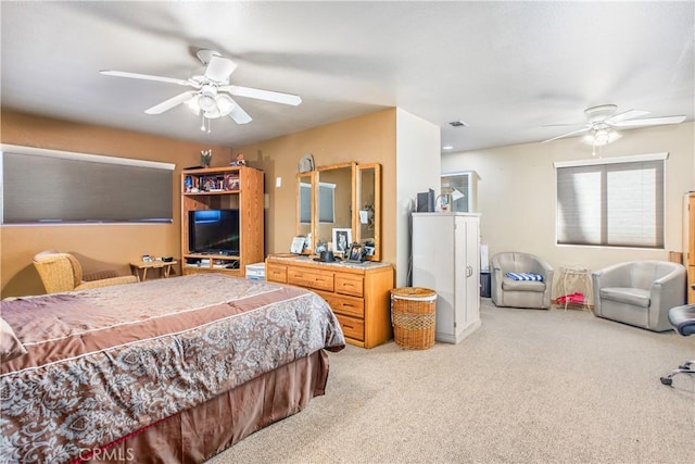 bedroom featuring ceiling fan and light carpet