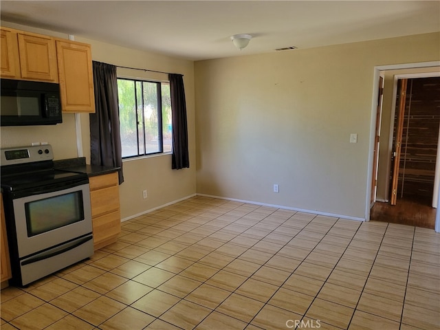 kitchen with light tile patterned flooring, light brown cabinetry, and stainless steel electric range