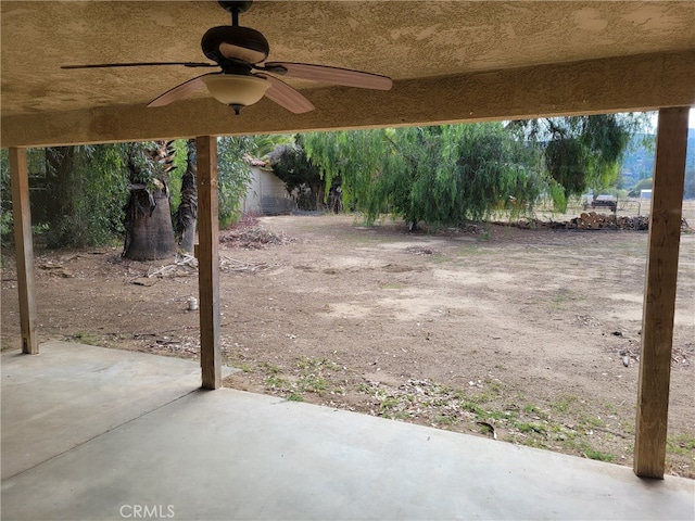 view of patio featuring ceiling fan