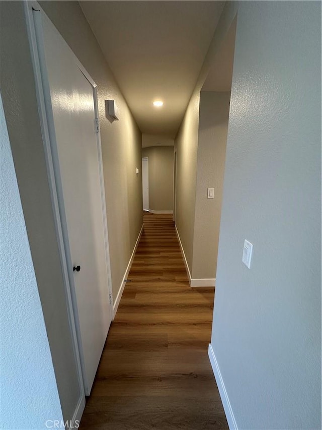 hallway featuring dark hardwood / wood-style floors