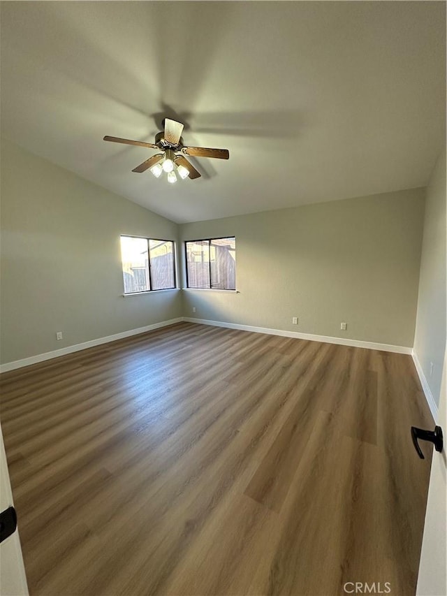 unfurnished room featuring ceiling fan, lofted ceiling, and wood-type flooring