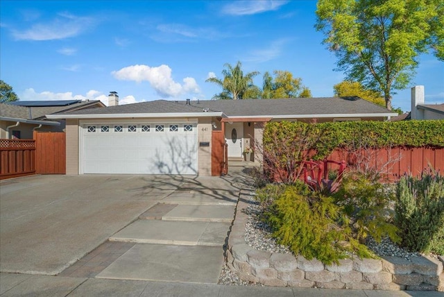 ranch-style home with a garage