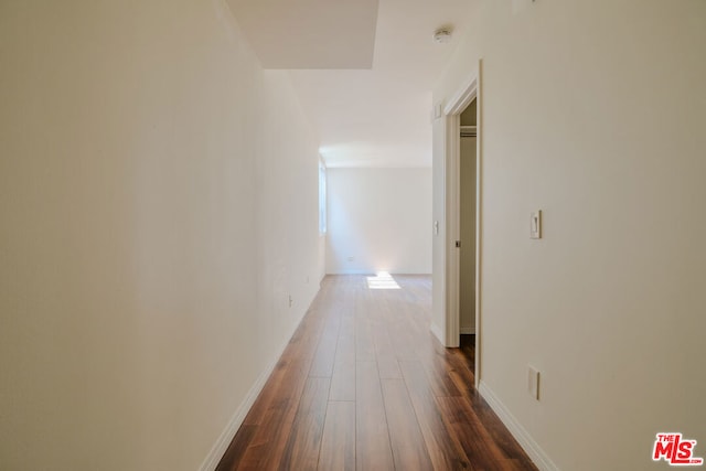 hallway featuring dark hardwood / wood-style floors