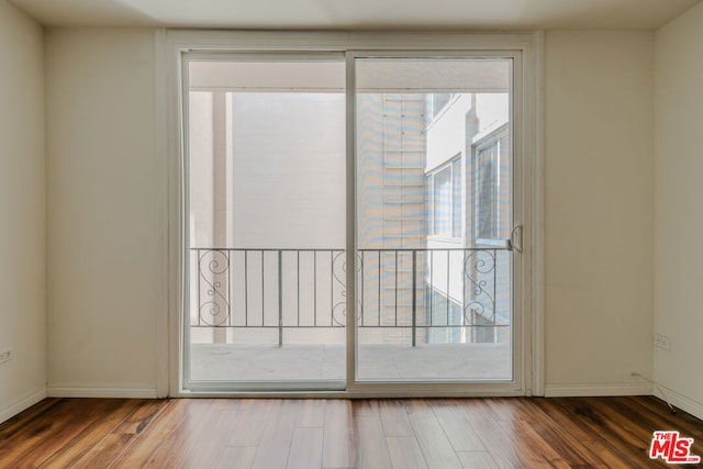 entryway with hardwood / wood-style flooring