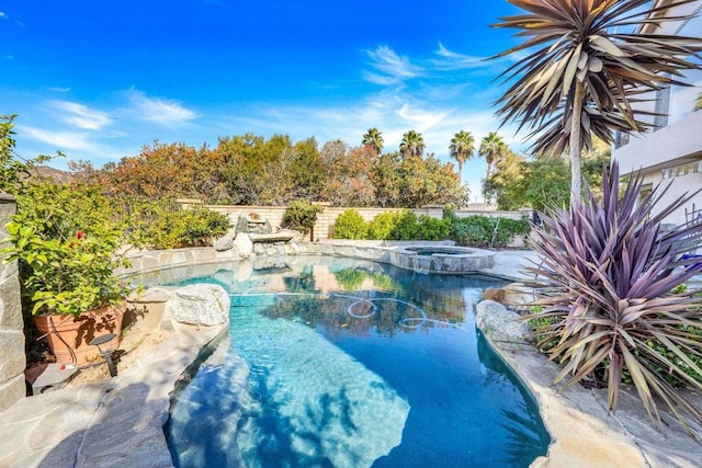 view of pool featuring an in ground hot tub